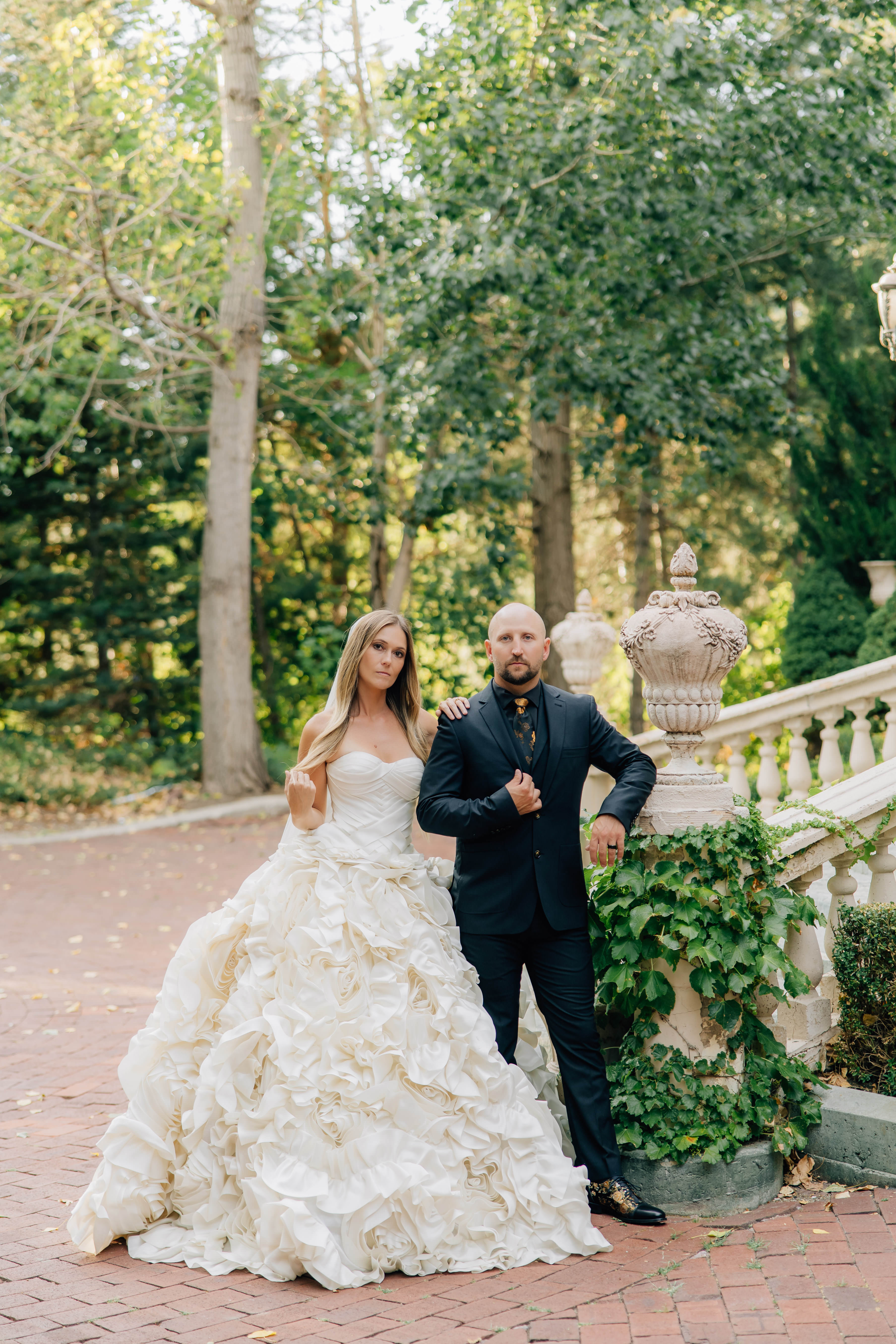 bride and groom standing next to each other