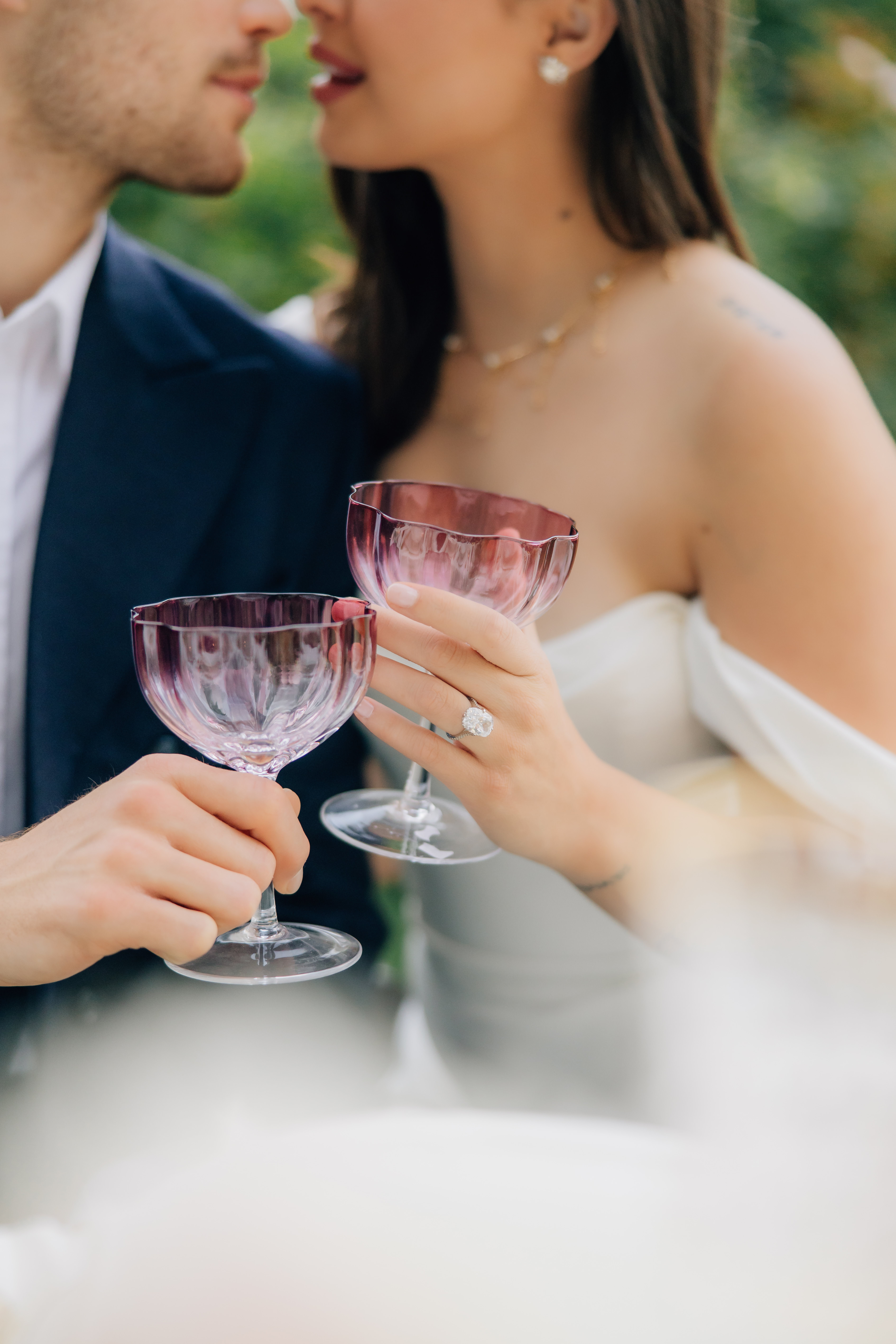 bride and groom toasting with a drink