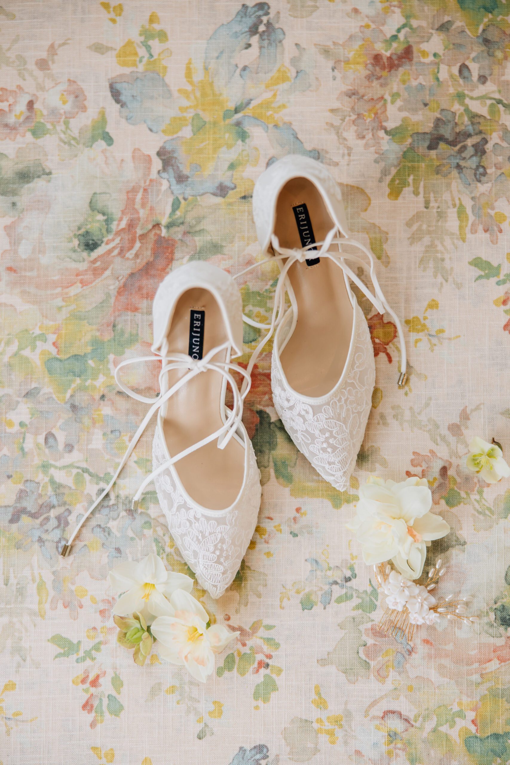 brides wedding shoes on a floral mat