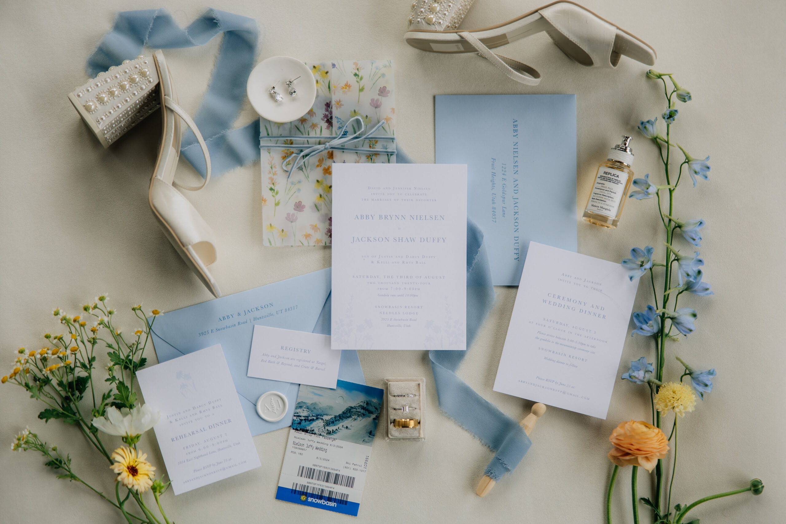 wedding invitation with wedding shoes and flowers